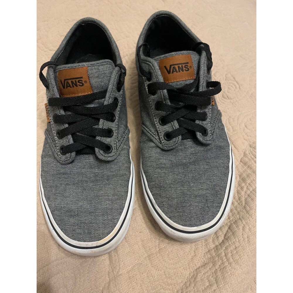 Men’s black denim and brown leather Vans